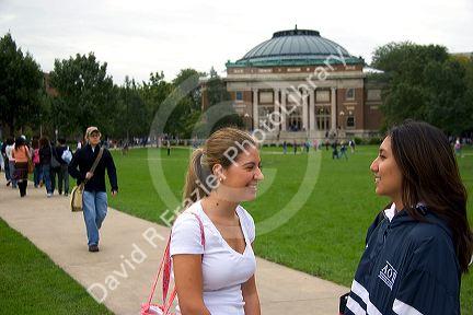 Female students socialize on the campus of the University of Illinois at Champaign.