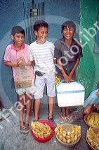 Young brazillian boys work as street vendors selling candy in Manaus Brazil.