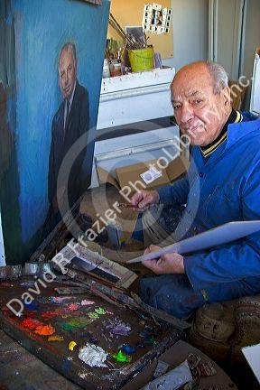 An artist painting a portrait on canvas in Boise, Idaho. MR