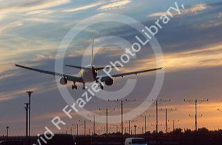 Airplane landing at sunset in Los Angelas, California at LAX airport.