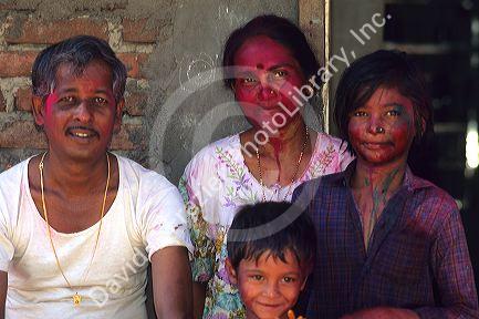 An Indian family wearing Holi Festival colors in India.