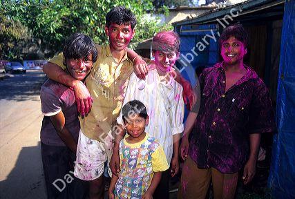 Young Indian men wearing Holi Festival colors in India.