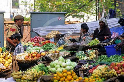 Street vendors selling fruit and vegetables in New Delhi India.