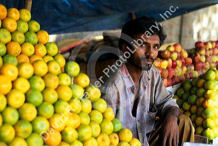 A street vendor selling fruit in India.
