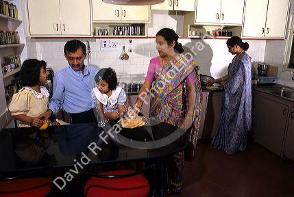 A middle class Indian family in their home at Bangalore, India.