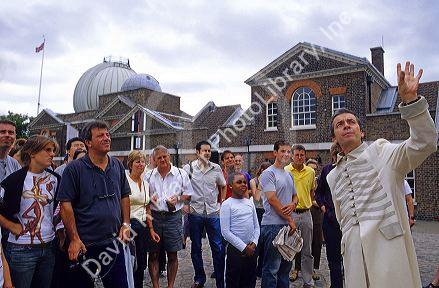 Tour guide at the London Observatory, England.  The site marks the Prime Meridian of the World where time begins.