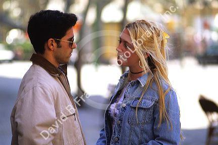 A man and woman talking close to each other in Majorca, Spain.