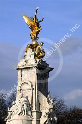 The Victoria Memorial statue and fountain in front of Buckingham Palace, London, England.