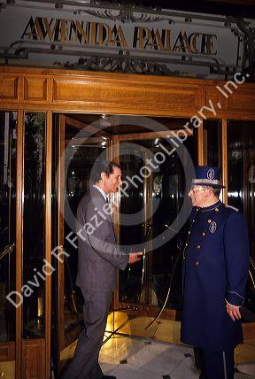 A doorman greets a guest at the Avenida Palace in Barcelona, Spain.
