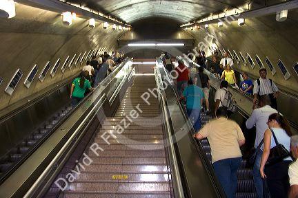People ride escalators at a subway station in Sao Paulo, Brazil.