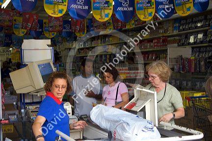 Customers in the check out line at a market in Sao Paulo, Brazil.