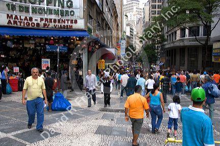 People and store fronts on a walking street in Sao Paulo, Brazil.