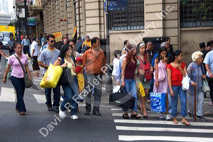 Pedestrians waiting to cross the street in Sao Paulo, Brazil.