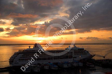 A cruise ship at sunset docked in Manaus, Brazil.