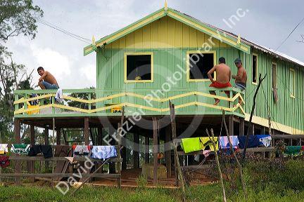 Daily life at a house on stilts in the Amazon jungle near Manaus, Brazil.