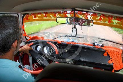 Inside public transit van across the Amazon River from Manaus, Brazil.