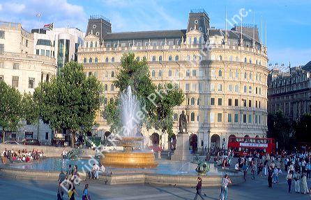 Trafalgar Square in London, England is crowded with local residents and tourists daily.