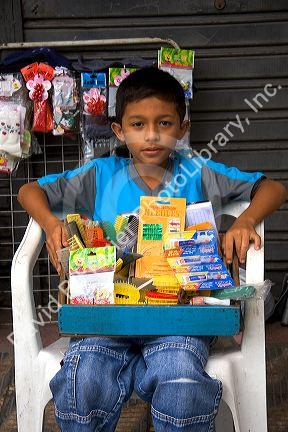 A Brazilian boy selling items on the street in Manaus, Brazil.