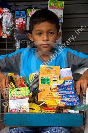 Brazilian boy selling items on the street in Manaus, Brazil.