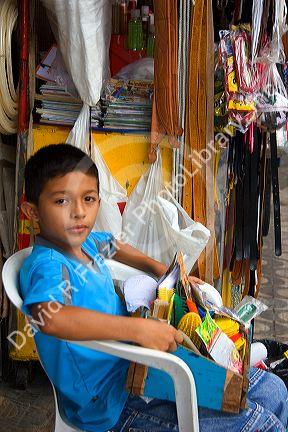 A Brazilian boy selling items on the street in Manaus, Brazil.