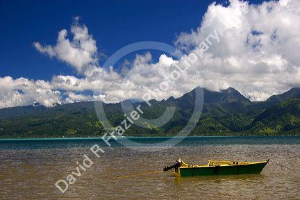 A boat in the lagoon off the island of Tahiti.