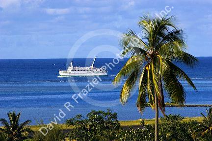 A ferry boat travels from the island of Moorea to the city of Papeete, Tahiti.