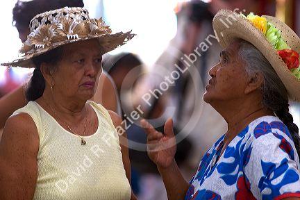 Elderly Tahitian woman at a market in Papeete on the island of Tahiti.