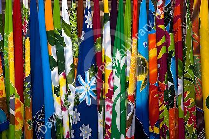 Colorful pareu wraps being sold at a market in Papeete on the island of Tahiti.