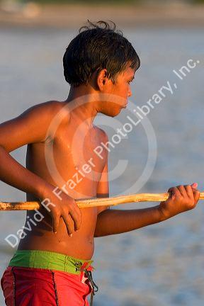 Tahitian boy fishing at Papeete, Tahiti.
