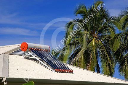 Solar water heater on the roof of a home on the island of Moorea.