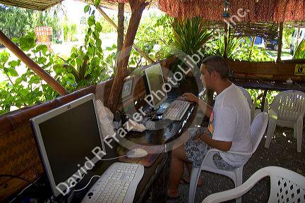 Internet cafe in a grass hut on the island of Moorea.