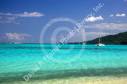 Sailboat anchored in the lagoon off the island of Moorea.