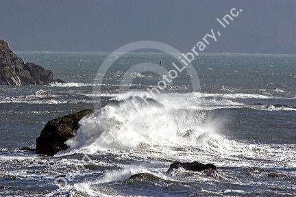Waves crash on rocks at Crescent City on the California coast.