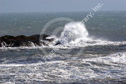 Waves crash on rocks at Crescent City on the California coast.