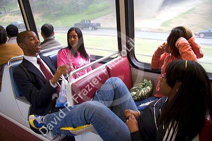Young adults ride on the Metrorail System in Washington, D.C.