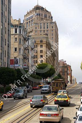 California Street scene with traffic and cable car in San Francisco, California.