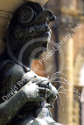 Statue and water fountain in Bologna, Italy.