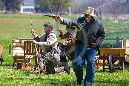 Men shooting guns during a civil war reenactment near Boise, Idaho.