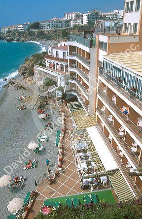 A cliffside view of the Hotel Balcon de Europa in Nerja, Spain.