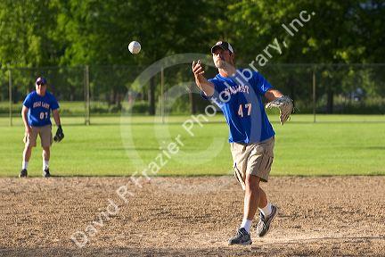 Man pitching in a game of softball in Boise, Idaho.