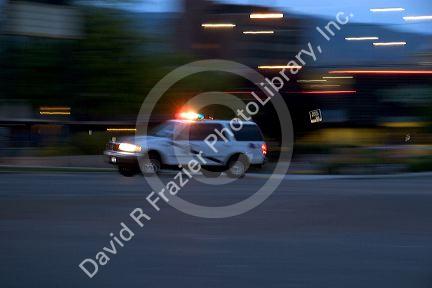 Emergency vehicle in motion with lights on in Boise, Idaho.