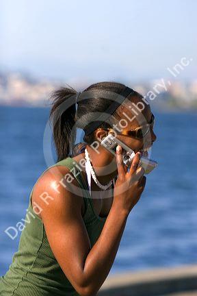 African american woman speaking on a cell phone in Seattle, Washington. MR