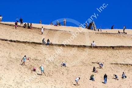 People play on sand dunes at Pacific City Point on the Oregon Coast.