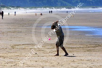 Beach golf being played at Pacific City on the Oregon Coast.