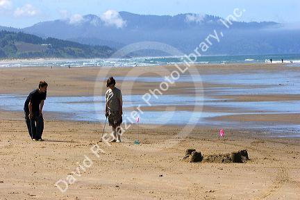 Beach golf being played at Pacific City on the Oregon Coast.
