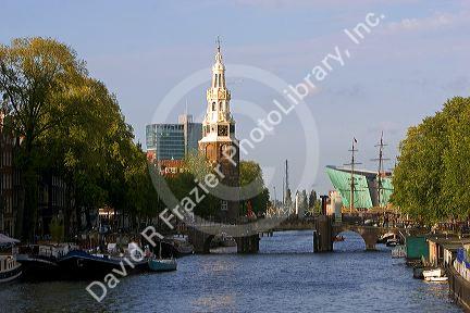 A view of the Amstel River the Montelbaans Tower and the NeMo in Amsterdam, Netherlands.