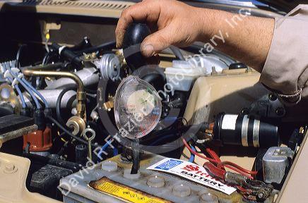 Hydrometer measuring the specific gravity of a car battery.