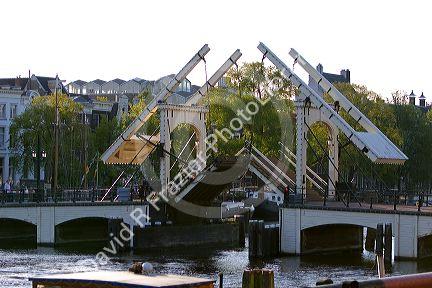 A drawbrigde crossing the Amstel River in Amsterdam, Netherlands.