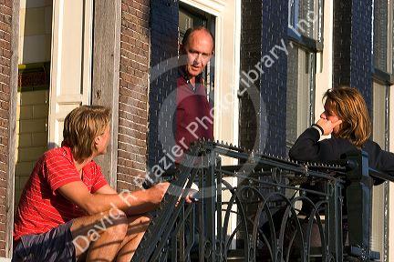 Neighbors living in row houses socialize in Amsterdam, Netherlands.