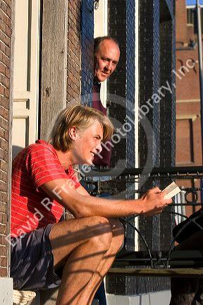 Neighbors living in row houses socialize in Amsterdam, Netherlands.